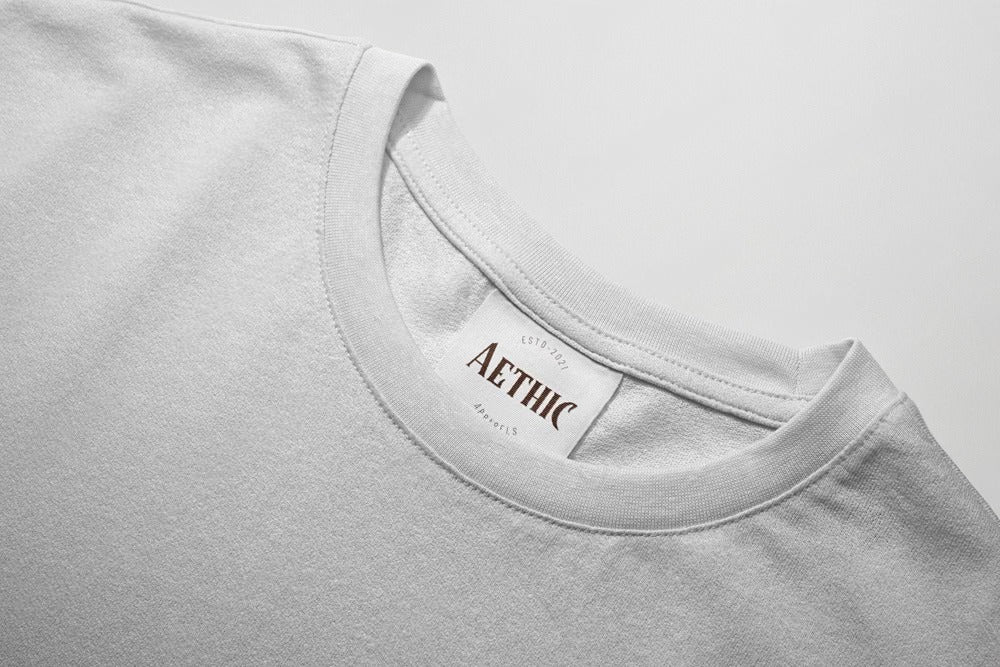 Colour_White t-shirt with 'AETHIC' label on a light gray background
