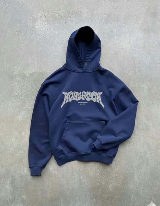 Navy blue hoodie with white logo on a gray concrete surface