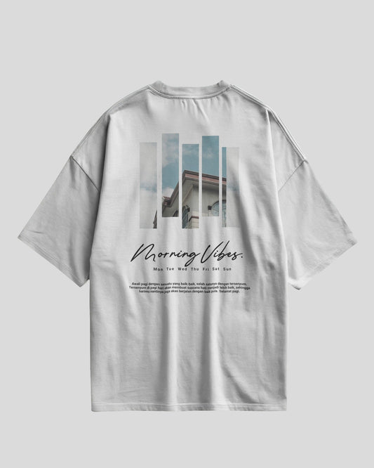 White t-shirt with graphic design and text on a light gray background