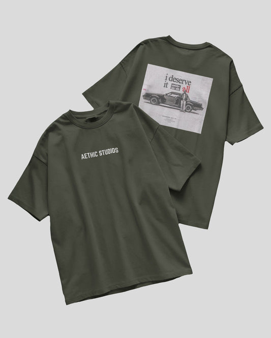 green 
oversized t-shirt with Attack Mode graphic and race car design on the back and Aethic Studios text on the front